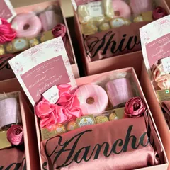 A closer look inside one of my popular bridesmaid proposal boxes. This one features a beautiful personalized satin robe, a donut-shaped soap, Ferrero Rocher chocolates, and a custom card to pop the question.