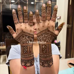 A beautiful and classic back of hand mehendi design. The combination of floral patterns and geometric shapes gives it a timeless elegance.