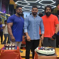 Another shot from a celebration at Kitty's Muscle Planet with Yash and my uncle. It's great to see high-profile clients become part of our gym family.