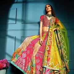 A powerful pose in a vibrant multi-colored lehenga. The strong lighting from the side highlights the model's form and the texture of the skirt, creating a striking image for a model's portfolio.