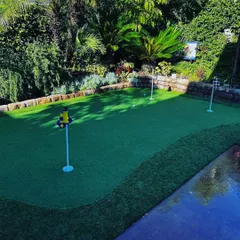 This custom green includes multiple holes, each with its own flag. You can practice a variety of putts without leaving your home.