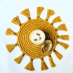 My sunburst placemats are not just for the dining table. Here, it serves as a beautiful base for a candle, creating a cozy and decorative centerpiece. I love seeing the creative ways you use my work in your homes.