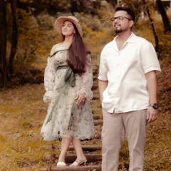 This look was designed for a rustic, nature-themed pre-wedding shoot. I created a custom floral organza dress with off-shoulder puff sleeves, paired with a straw hat for a touch of countryside charm.