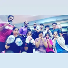 Our tribe is diverse, with men and women of all ages and fitness levels. Here, a group of our female members are ready for their boxing drills. Everyone is welcome, everyone trains hard.