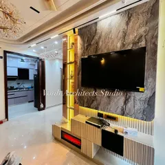 This living room is the heart of a home I recently completed. I designed the TV unit with a dramatic marble-finish backdrop and integrated lighting to be both a functional media center and a stunning piece of art, showcasing my commitment to bespoke, luxury interiors.