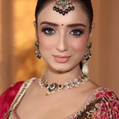 A close-up of my beautiful bride. Her stunning eyes are enhanced with sharp winged eyeliner and soft eyeshadow, perfect for her traditional wedding look.