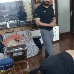 Observing my client's form closely during a floor exercise. My complete attention is on you during our sessions.