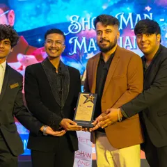 Proudly accepting my award on stage. This recognition fuels my passion to continue pushing the boundaries of magic and performance.