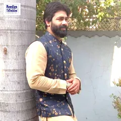 A Nehru jacket is a timeless addition to any man's wardrobe. This client is wearing a custom-stitched floral print Nehru jacket over a simple kurta, creating an elegant and effortless look for a daytime event.