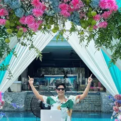 Ready to kick off a summer pool party. The floral decor, the poolside setup, and a playlist full of sunny vibes are all in place for a perfect daytime celebration.