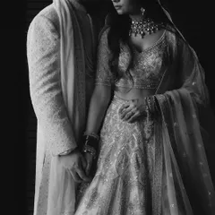 An intimate black and white portrait of Amreet and Saksham, the soft light and their close embrace creating a deeply romantic and timeless feel.