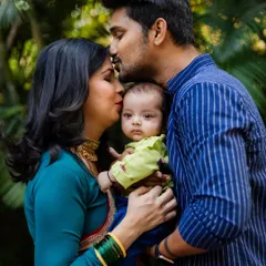 A newborn's first few weeks are so fleeting. Capturing the love of new parents during their baby's naming ceremony is an honor. This portrait shows the complete circle of family love.