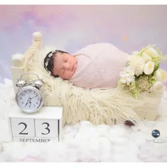 A dreamy, celestial-themed portrait with the baby sleeping on a bed of clouds. The calendar block and clock are perfect for creating a personalized birth announcement.
