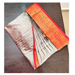 This is the final result of my pre-pleating and box folding service. The pleats are set, and the saree is folded to prevent wrinkles, making it incredibly easy to wear. This grey and red saree is ready for my client.