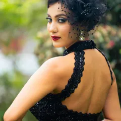 The backless top and elegant pose add to the drama of this editorial look. The makeup is designed to be striking from every angle.