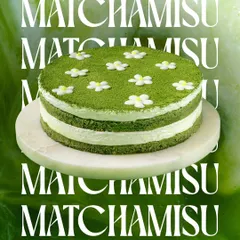 Our Matchamisu, a Japanese-inspired twist on the classic Tiramisu. It's decorated with delicate sugar flowers, making it as beautiful as it is delicious.