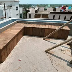 A work-in-progress shot of a custom L-shaped bench being built on a terrace. We use Ipe, one of the hardest woods in the world, to ensure maximum durability.