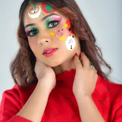This angle shows the placement of the cute Christmas characters on the forehead and cheek. The look is playful yet polished, perfect for a holiday party or themed content.