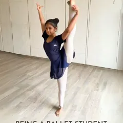 A student demonstrates a beautiful standing split. This level of flexibility and control is the result of consistent practice and dedicated training.