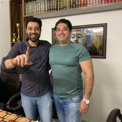 A candid moment in my office with a friend and colleague. Building strong professional relationships is a key part of my practice and helps create a supportive network for everyone.