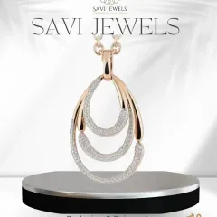 This designer pendant showcases a unique, three-tiered teardrop silhouette. Crafted from a client's old gold and diamonds, it's now a modern, sculptural piece that makes a statement.