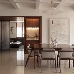 Another view of the Altamount Road apartment, showing how our custom pendant lights complement the dining set and the integrated bar unit in the background. Each lighting element is chosen to enhance the room's function and feel.