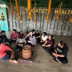 A group of friends celebrating a birthday with a shared yoga practice. This is what community is about: supporting each other's journey towards health and happiness.