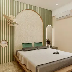 A tranquil bedroom retreat designed with a harmonious blend of earthy textures and soft green accents. The statement arched headboard, set against a striped wallpaper, creates a refined focal point. Natural wood details on the bed frame and wardrobe bring warmth and a sense of calm to the space.