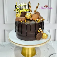 The ultimate chocolate experience. This drip cake is loaded with Ferrero Rocher, Oreo cookies, and chocolate bars.
