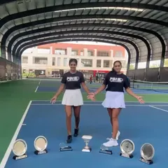 A moment of triumph for our formidable doubles duo at our home academy. Akanksha Nitture and Soha Sadiq proudly display their trophies from three consecutive successful weeks on the professional circuit.
