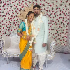 Here is our lovely client Geeta with her husband, creating a beautiful memory on their special day. She is draped in a vibrant yellow Kanchipuram silk saree, a perfect choice for a wedding ceremony that radiates happiness and tradition.