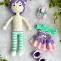 Here you can see all the pieces for this dress-up doll. She has a tutu dress, shoes, and a little backpack, all of which are removable for hours of fun mixing and matching.