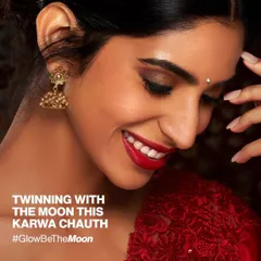 A stunning festive look for a client celebrating Karwa Chauth. The deep red lipstick is perfectly complemented by flawless, neutral gel nails, creating a timeless and elegant style.