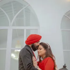 A tender kiss on the forehead, set against a clean, white backdrop. This intimate moment is a beautiful way to celebrate a milestone anniversary.