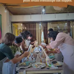 Friendship and creativity go hand in hand. Here, a group of friends enjoys a painting session together, sharing laughs and making art in our cozy space.