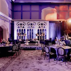 For Neomi and Rakshit's Sangeet, we designed a dramatic 'Gothic Palace Ball'. The hall was transformed with bold structures, Gothic arches, and a moody blue and purple lighting scheme, creating a sophisticated and high-energy celebration.