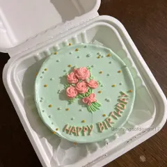 A lovely birthday bento cake with a hand-piped floral bouquet design. It's a beautiful and delicious way to send your birthday wishes.