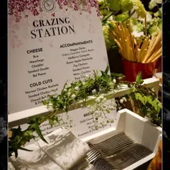 A closer look at the thoughtful details of a curated grazing station. The custom menu, neatly folded napkins, and elegant cutlery are all part of the seamless and professional experience I provide for every event.