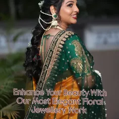 Elegance from every angle. This shot highlights the delicate floral hair accessory and jhumkas, completing this beautiful baby shower look.
