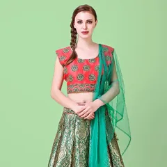 My portfolio includes shooting ethnic wear with international models. This image features a model in a colorful brocade lehenga against a soft green background, perfect for an online boutique catalogue.