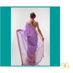 The back view highlights the beautiful transparency of the silk organza fabric and the detailed zari work along the border.