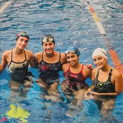 A happy moment in the pool with Rhea Gupta (far right) and her teammates. Rhea's journey from a young swimmer to a student at a top US university is an inspiration to us all.