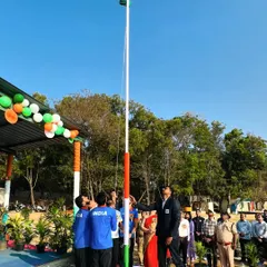 A wide shot of the flag being raised high against the clear blue sky. This symbolizes the heights we aim to reach for our country in the world of sports.