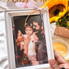 We included a precious family photo of Alia, Ranbir, and Raha in the custom hamper we designed for them.