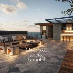 This expansive rooftop terrace is designed for entertaining. It features a built-in bar with ambient lighting, extensive lounge seating, and open views, creating the ultimate outdoor social space.