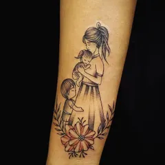 Some stories are best told with delicate lines. We created this heartfelt family tattoo to capture the eternal bond between a mother and her children. It’s a piece that celebrates love and connection, designed to be a timeless tribute.