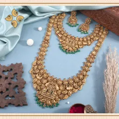 This layered temple jewellery set showcases intricate carvings of peacocks and deities, finished with green bead droplets. I design these sets to offer a complete, regal look for brides.