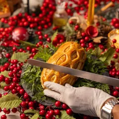The moment of carving the Wellington. Our white-glove service can be a part of your at-home experience, ensuring every detail is handled with care.
