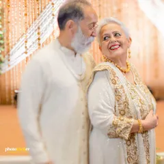 A classic, elegant portrait of the couple on their golden anniversary. Their expressions of love and companionship are truly timeless.