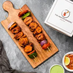 A close-up of our Tandoori Soya Chaap, highlighting the texture and vibrant color from the marinade. This is a fantastic vegetarian alternative that's packed with protein and flavor.